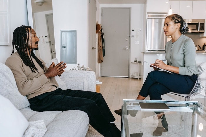 A man in a one to one therapy session at rehab in Cheltenham