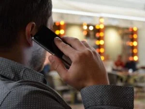 A man talking on the phone in Milton Keynes