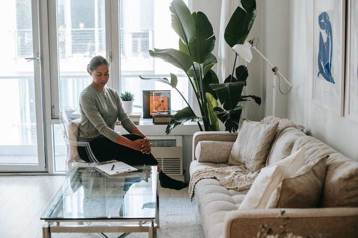 A woman sitting in her front room in Norfolk