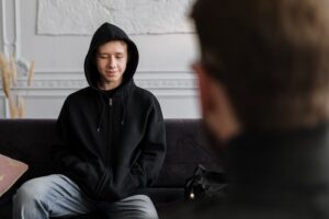 A young man in a therapy session in Blackburn