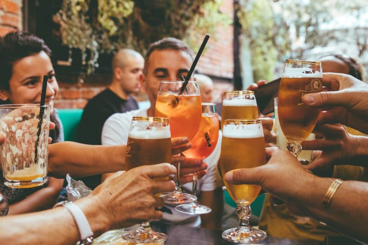 group of people cheersing their drinks