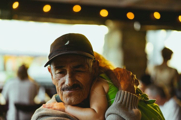 An elderly man and granddaughter