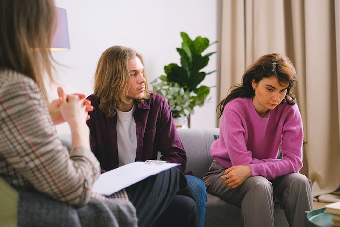 A man and woman in a therapy session at drug and alcohol rehab in Belfast