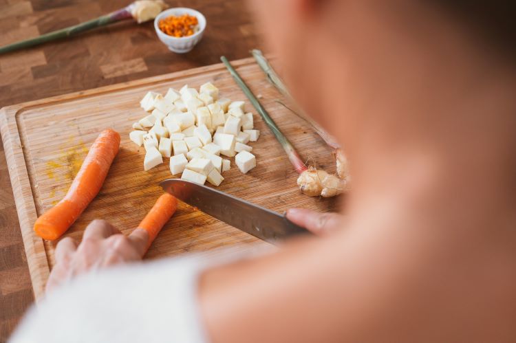 A woman chopping vegetables