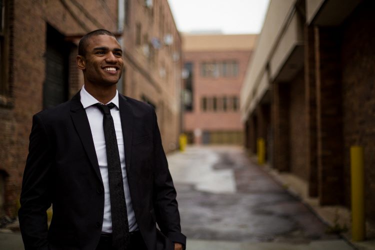 Man smiling in a suit