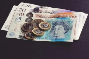 Pound notes and coins symbolising the cost of detox and treatment at drug and alcohol rehab Bradford