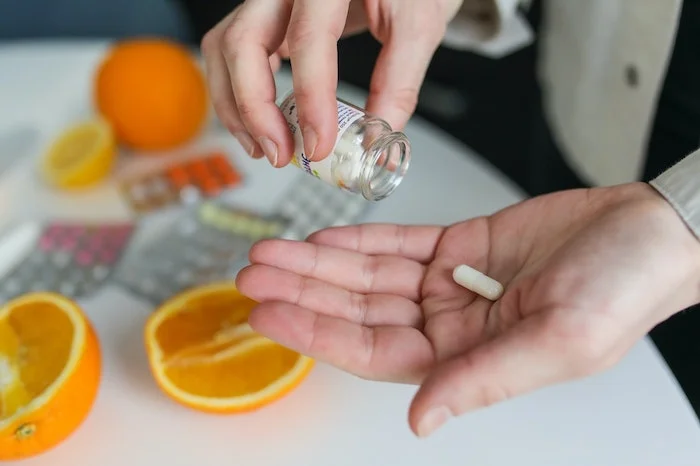 Person holding pills in Reading