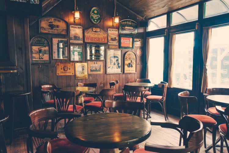 A traditional British pub with alcohol artwork on the walls