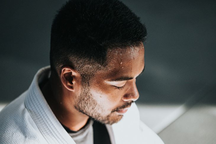 man with bead of sweat on forehead