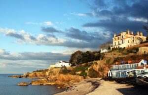 View of beach and house on the cliff in Bristol