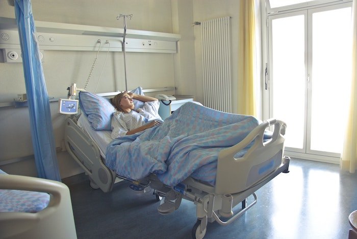 A woman in hospital bed at drug and alcohol rehab in Berkshire