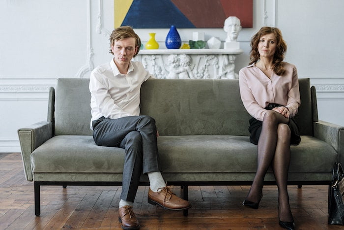 two people in a therapy session sitting on a sofa discussing life after addiction in Carlisle