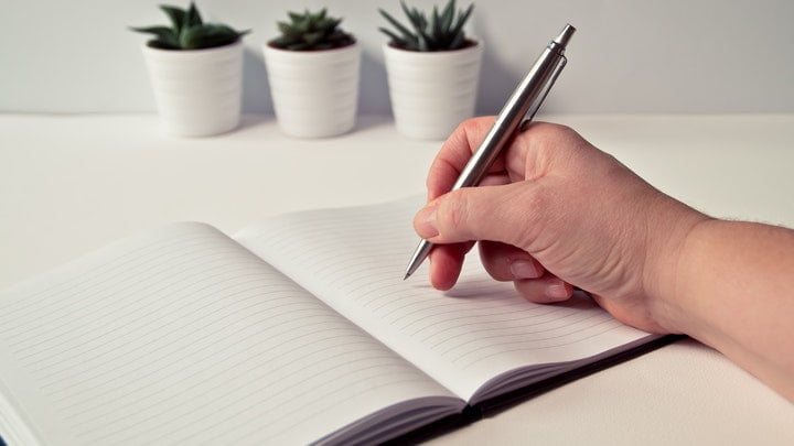 Person taking notes at a drug and alcohol rehab in Ipswich