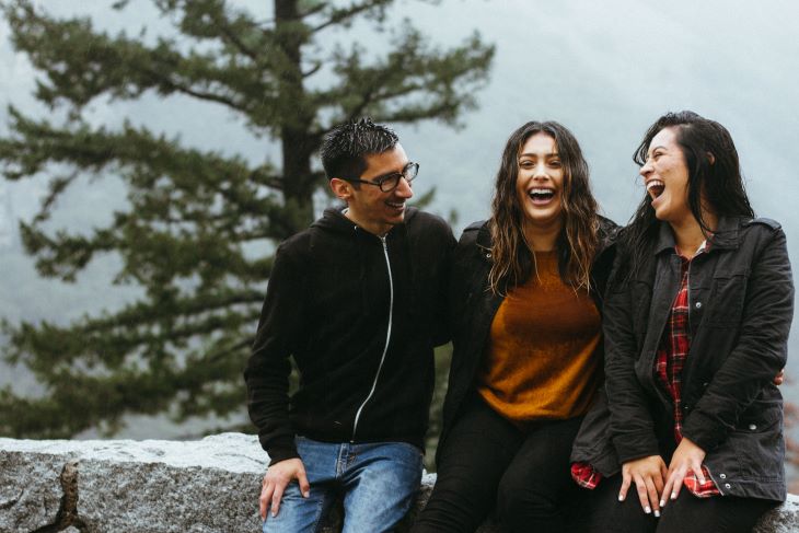 Three friends laughing