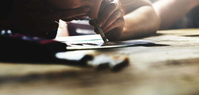 A person snorting a line of coke