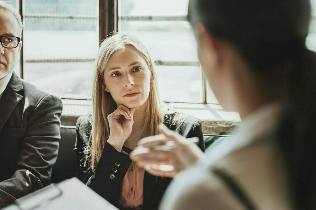 people in meeting with therapist