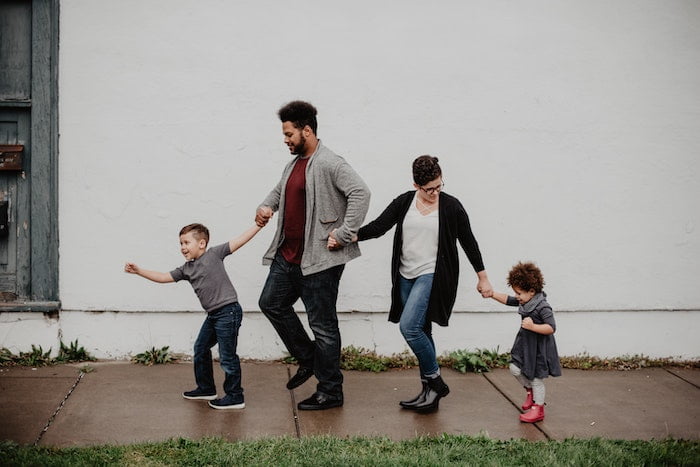 family walking along the street