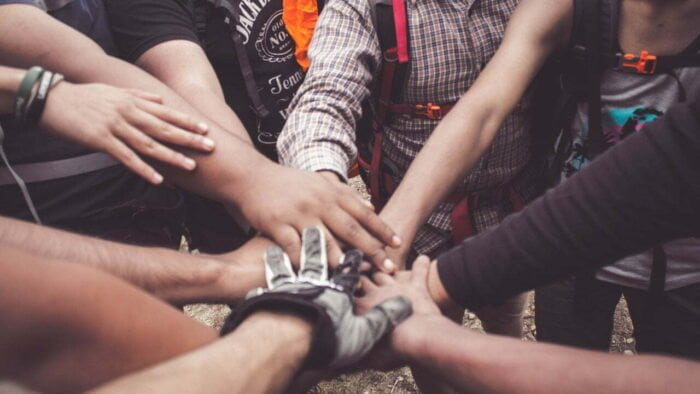 Support group hands at a rehab in Scarborough