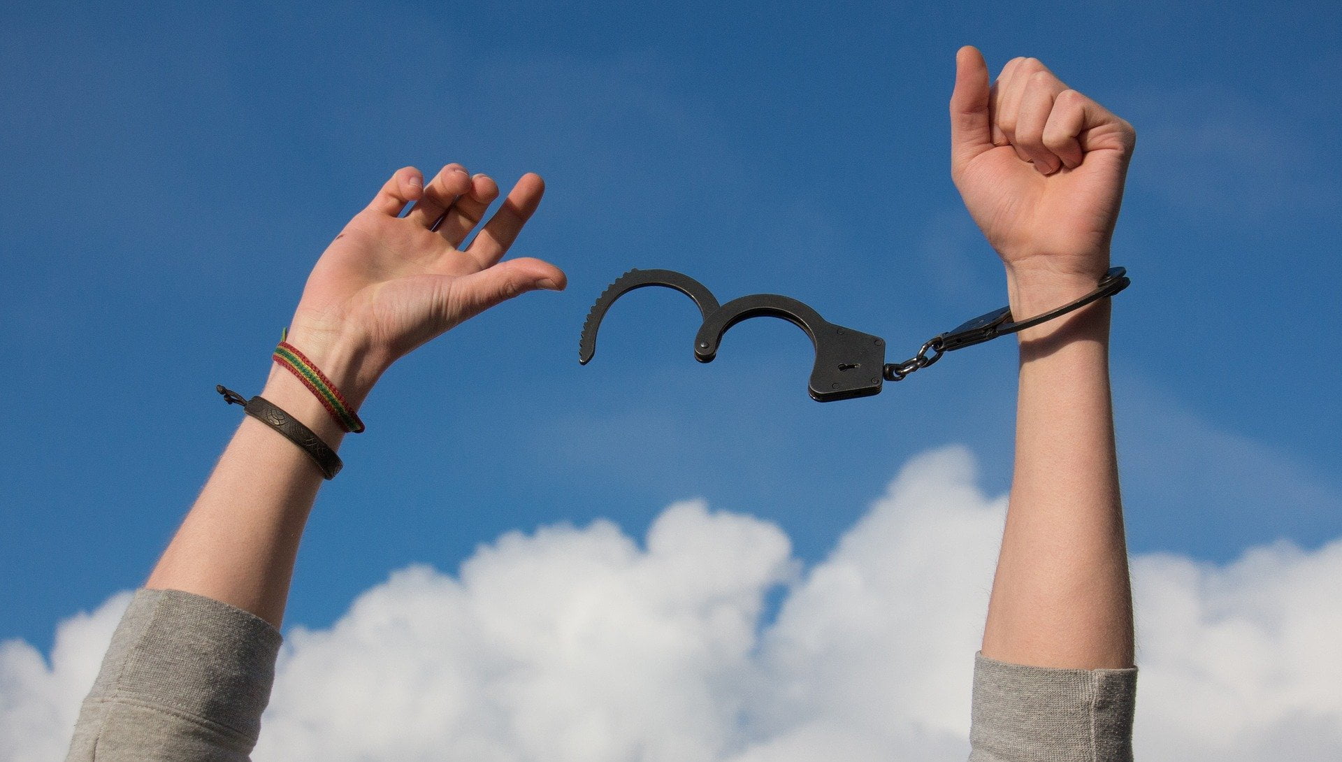 A person removing handcuffs