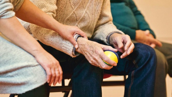 Two people holding hands