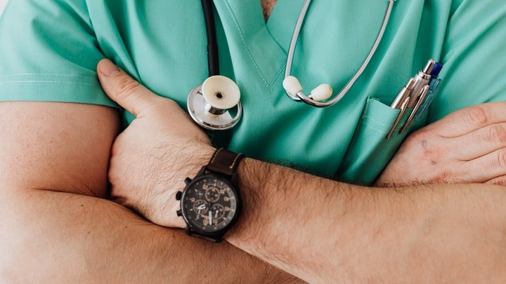 A doctor assessing a patient's health during alcohol detox