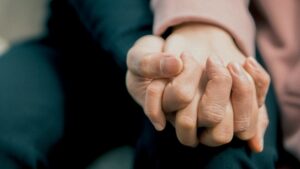 Two people holding hands before drug and alcohol rehab