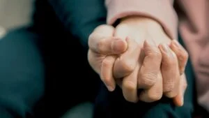 Two people holding hands at a drug rehab & alcohol rehab in Bedfordshire