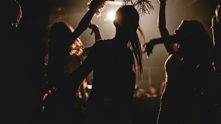 group of people dancing in club