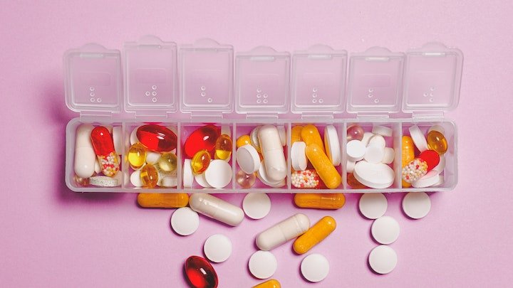 pill box filled with various pills