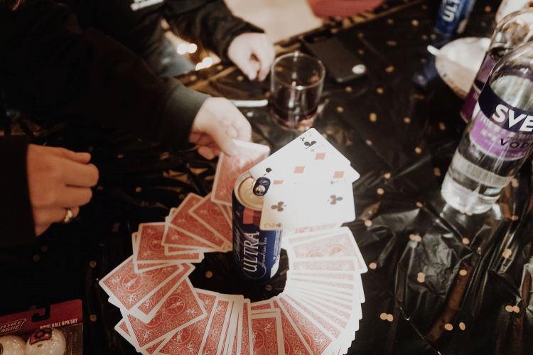 A college drinking game with playing cards