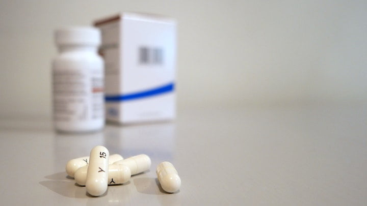 A packet of pills with capsules on the table