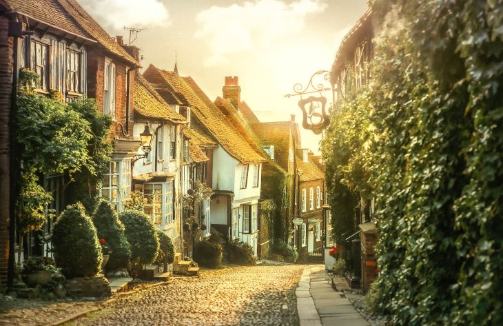 A street with houses, lit by sunset