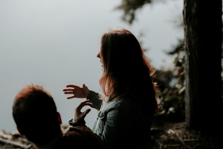 A young woman talking and gesticulating