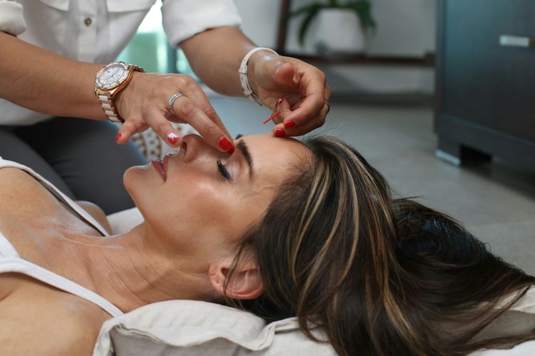 A woman receiving acupuncture for addiction