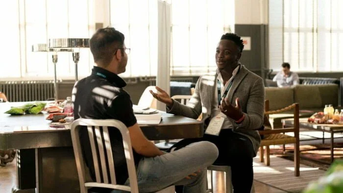 Man talking to a staff member about alcohol-related death at a rehab clinic