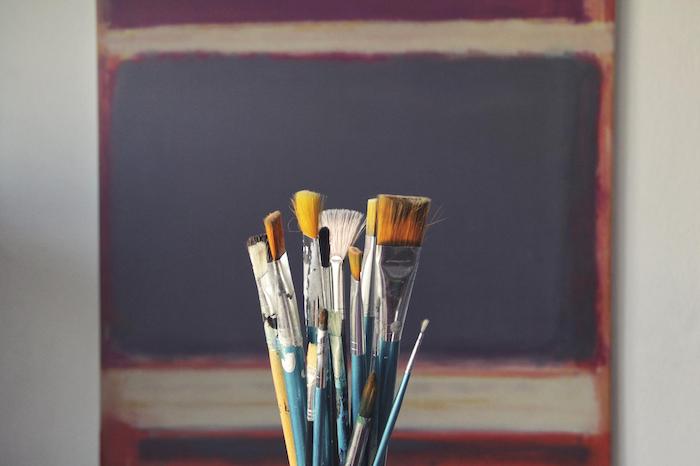 Paintbrushes set up for art therapy as part of an addiction recovery programme