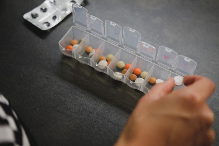 Person taking medication for alcohol-related brain damage
