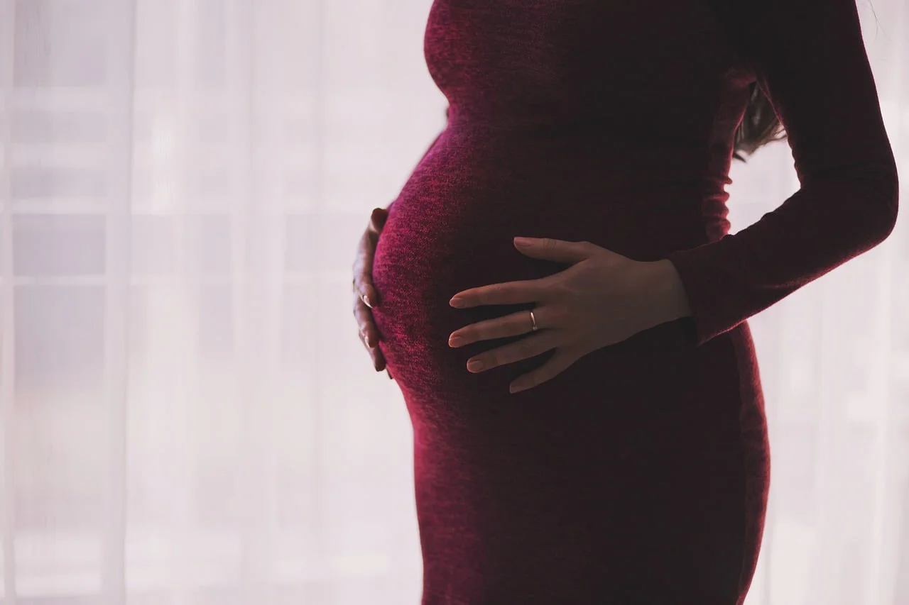 Pregnant woman thinking about postpartum depression
