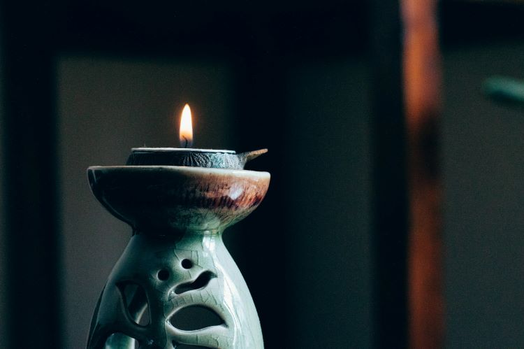 A candle in a decorative holder