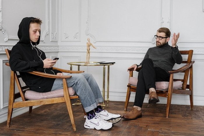 Young person sat in an addiction counselling session