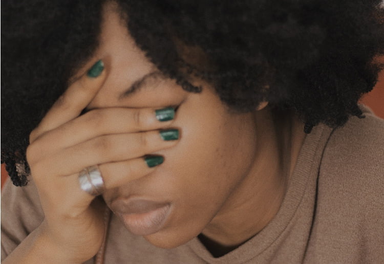 Woman looking stressed and thinking about alcohol alcoholism in the medical profession